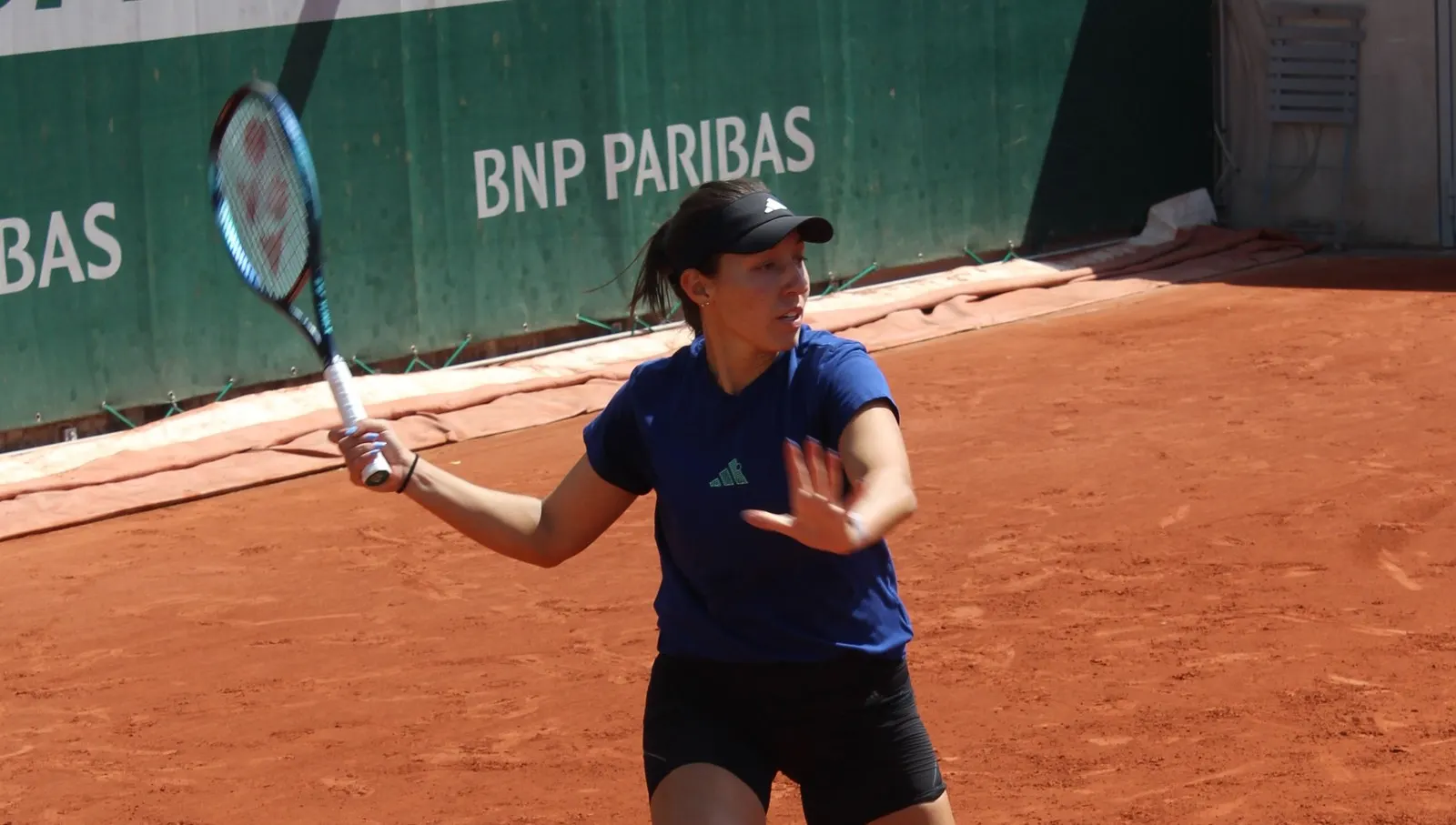 Adult tennis player Jessica Pegula preparing a forehand with her racket at Roland Garros, France, illustrative image